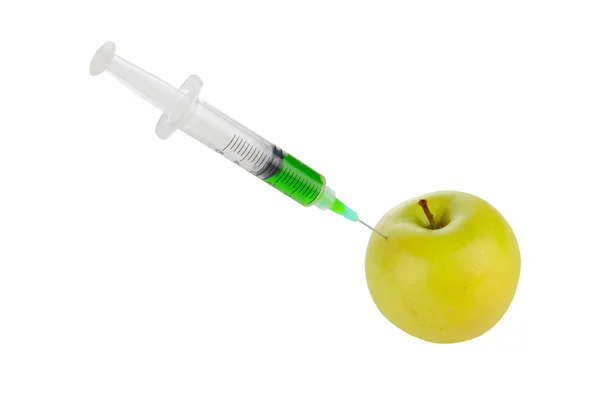 Siringa inserita in una mela — Foto Stock