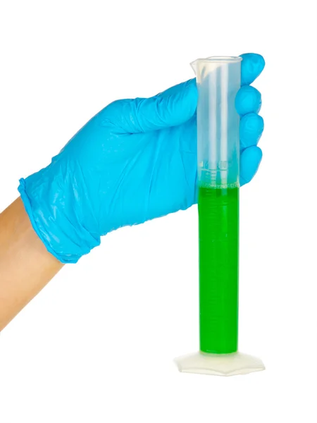 Gloved hand with green liquid — Stock Photo, Image