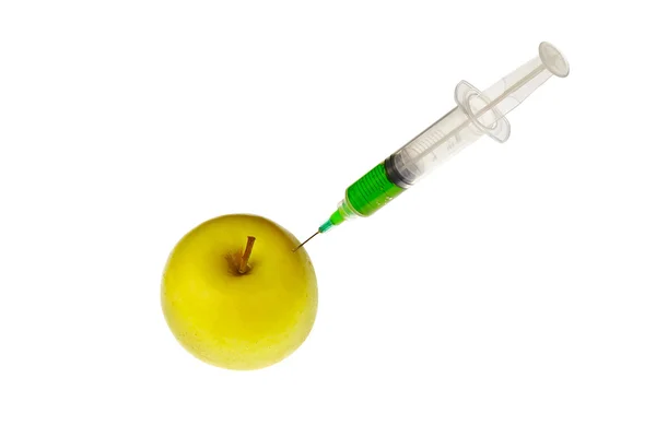 A syringe inserted in an apple — Stock Photo, Image