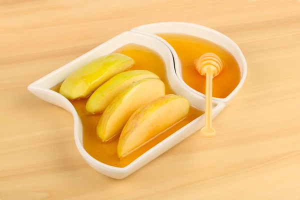 Apples in honey — Stock Photo, Image