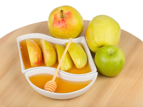 Pommes et tranches de pommes trempées dans le miel — Photo