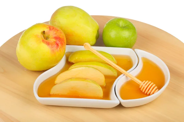 Apples and dipping slices of apple in honey — Stock Photo, Image