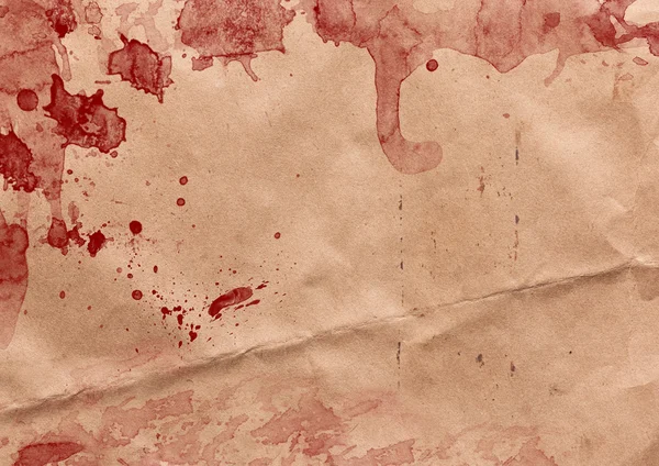 Vrásčitá papír s červenou krevní skvrny — Stock fotografie