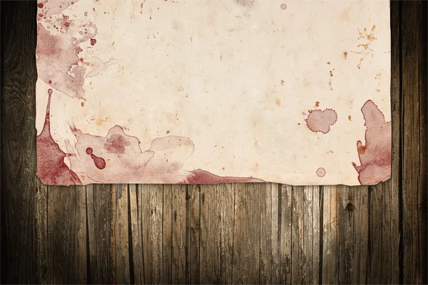 Beschadigde oud papier met rood bloedvlekken — Stockfoto