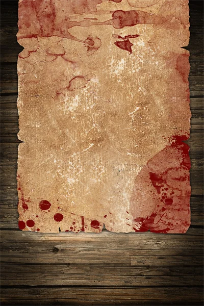 Vintage papíru list s krvavé skvrny na tmavém pozadí dřevěná — Stock fotografie