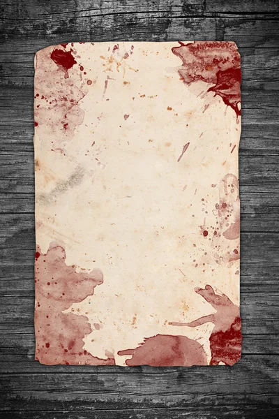 Vintage papier blad bedekt met bloed — Stockfoto