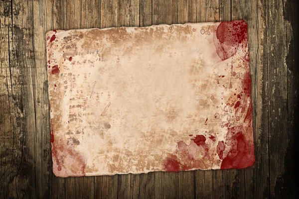 Old bloody paper on wood Royalty Free Stock Images