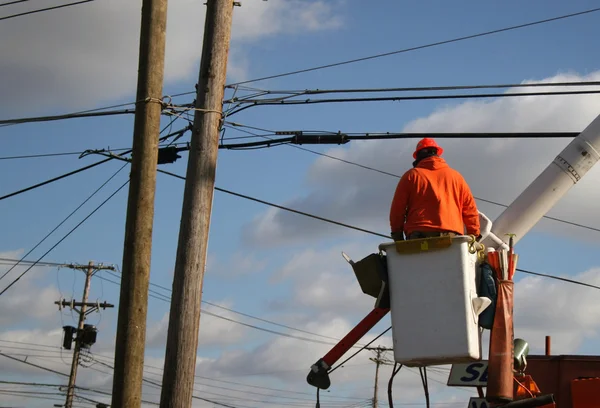 A utility lineman at work Royalty Free Stock Images