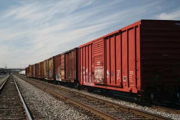 Railroad box cars n a track siding in a rail yard Stock Picture