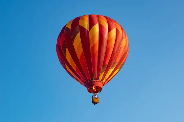 Red Hot air balloon on deep blue sky