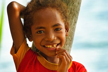 Papua Province, Indonesia - Circa January 2011: Unidentified children on the street in Wamena, on New Guinea Island, Indonesia . clipart