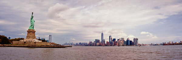Statue of Liberty and Manhattan skyline panorama., New York City, panoramic view