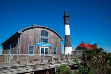 The Fire Island Lighthouse is a visible landmark on the Great South Bay, in southern Suffolk County, New York . United States clipart