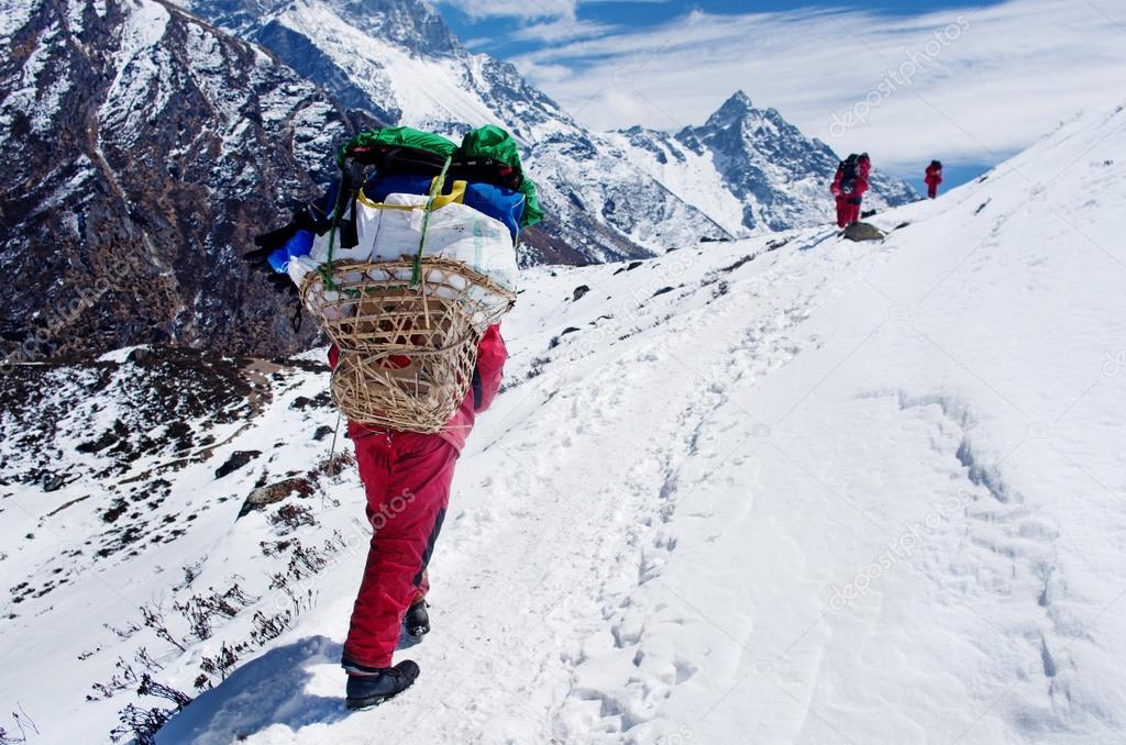 Porters with heavy load,  Nepal 