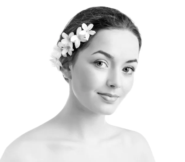 Mujer con flores en el pelo —  Fotos de Stock