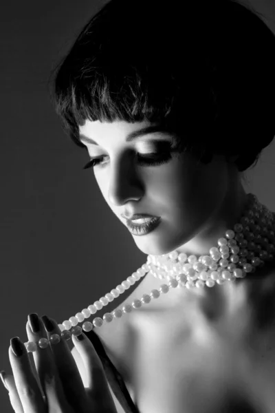 Brunette girl with pearls necklaces — Stock Photo, Image