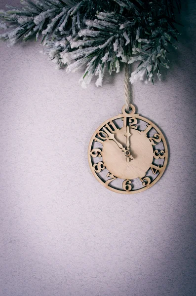 Clock on fir tree branch — Stock Photo, Image