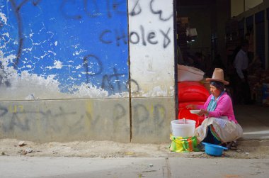 Peruvian woman on street market clipart