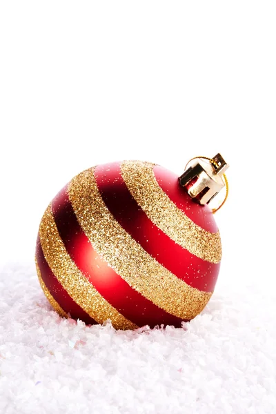 New Year's striped ball on snow. Stock Picture