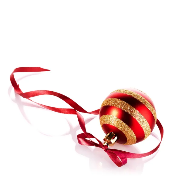 Striped New Year's ball with a red tape. — Stock Photo, Image