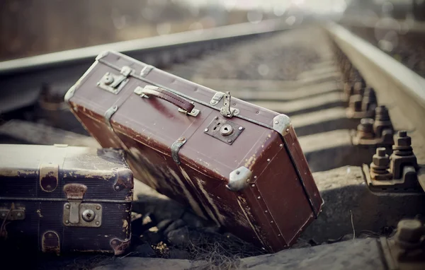 Two vintage suitcases on rails — Stock Photo, Image