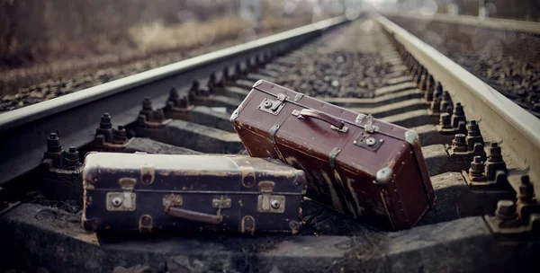 Two vintage suitcases thrown on railway rails. — Stock Photo, Image