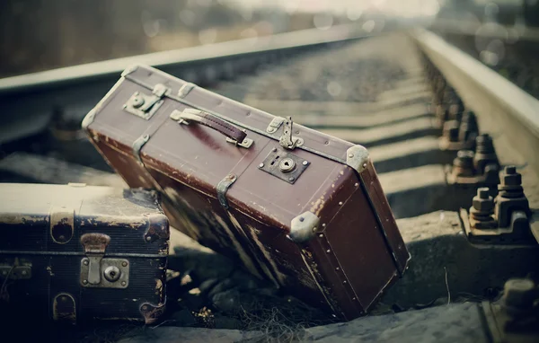 Old fashioned a suitcases on railroad tracks — Stock Photo, Image