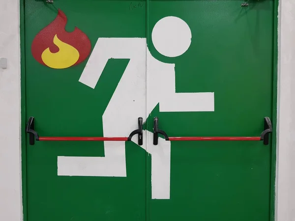 Image of a man running on a fire exit