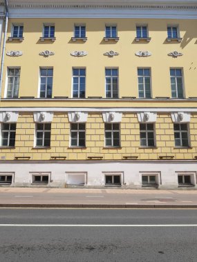 Windows with bas-reliefs in an old stone house