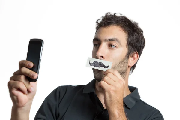 Casual man göra selfie porträtt med falska mustasch Stockbild