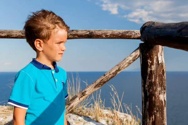 Portrait of pensive, serious boy on background of mountains, Italy — Stock Photo, Image