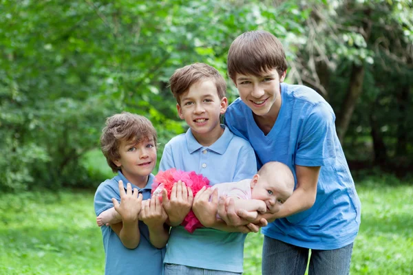 Portrait of three happy brothers and sisters — Stock Photo, Image