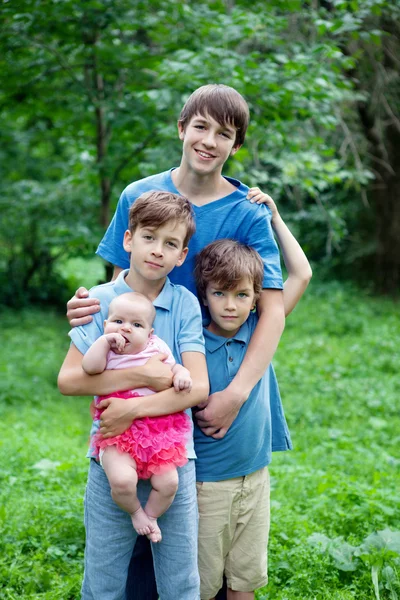 Portrait of three happy brothers and sisters — Stock Photo, Image