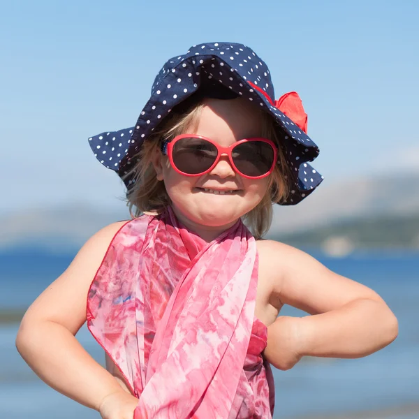 Portrait of happy baby girl in hat and sunglasses — Stock Photo, Image