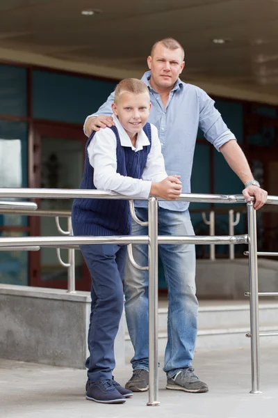 Portrait of happy father and teenager boy. — Stock Photo, Image