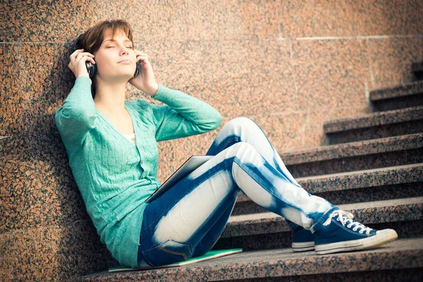 Beautiful young woman student with headphones. Outdoor music girl — Stock Photo, Image