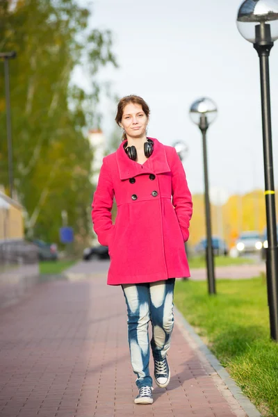 Beautiful woman in red coat walking autumn street. — Stock Photo, Image