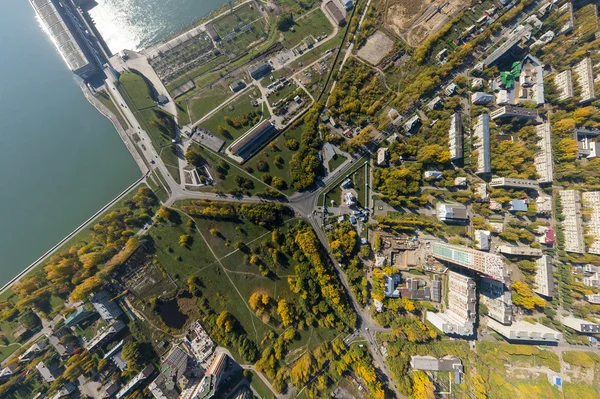 Aerial water power plant view with crossroads and roads, civil  buildings.