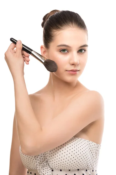 Young brunette woman with clean face. Girl perfect skin applying cosmetic brush. Isolated on a white. — Stock Photo, Image