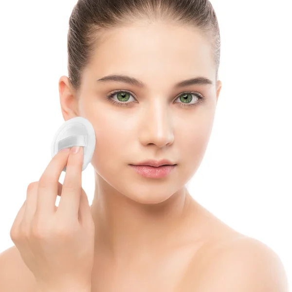 Young woman cares for face skin. Cleaning perfect fresh using cotton pad. Isolated. — Stock Photo, Image