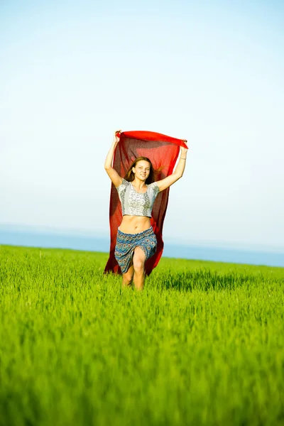 Young happy woman in wheat field with fabric. Summer lifestyle — Stock Photo, Image