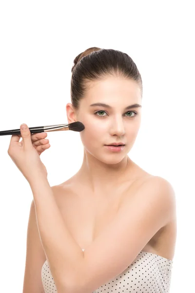 Young brunette woman with clean face. Girl perfect skin applying cosmetic brush. Isolated on a white. — Stock Photo, Image