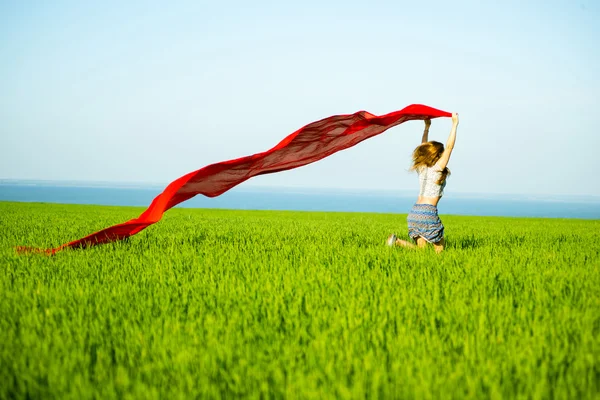 Young happy woman in wheat field with fabric. Summer lifestyle — Stock Photo, Image