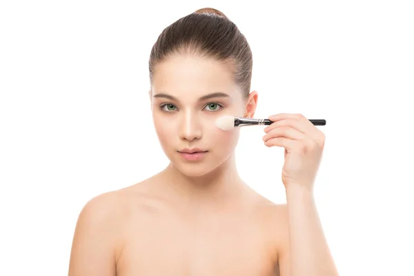 Young brunette woman with clean face. Girl perfect skin applying cosmetic brush. Isolated on a white. — Stock Photo, Image