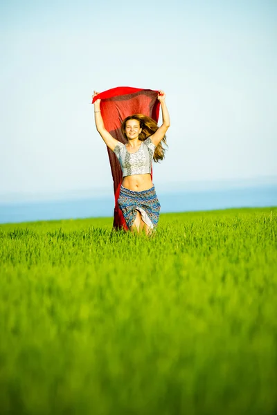 Young happy woman in wheat field with fabric. Summer lifestyle — Stock Photo, Image