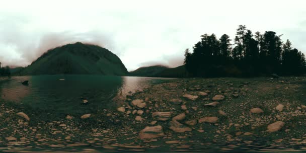 Time lapse of Mountain lake 360 vr at the winter time. Wild nature and mount valley. Green forest of pine trees and fast clouds on sky. — Stock Video