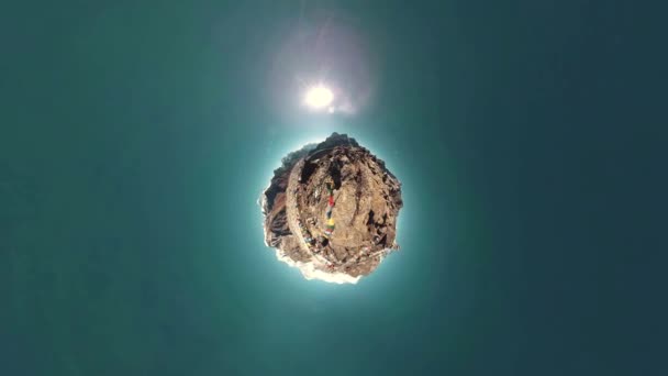 Gokyo Ri mountain top. Tibetan prayer Buddhist flag. Wild Himalayas high altitude nature and mount valley. Rocky slopes covered with ice. Tiny planet transformation — Stock Video