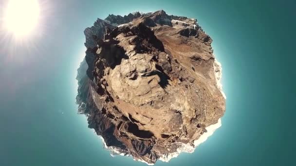 Gokyo Ri mountain top. Tibetan prayer Buddhist flag. Wild Himalayas high altitude nature and mount valley. Rocky slopes covered with ice. Tiny planet transformation — Stock Video