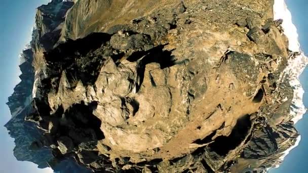 Gokyo Ri mountain top. Tibetan prayer Buddhist flag. Wild Himalayas high altitude nature and mount valley. Rocky slopes covered with ice. Tiny planet transformation — Stock Video