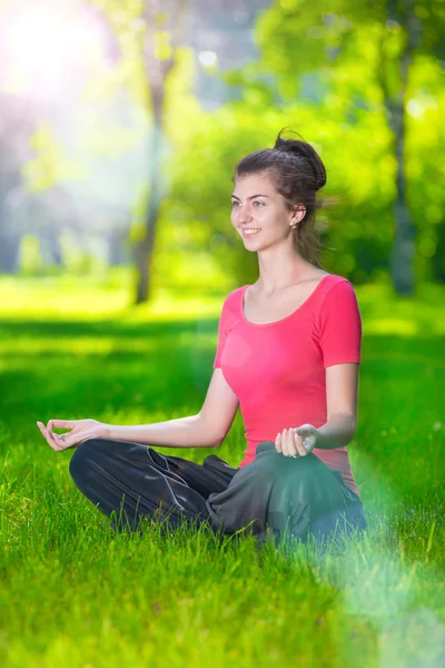 Young woman doing yoga exercises — Stock Photo, Image